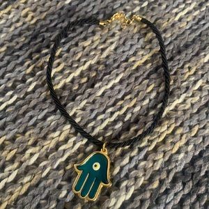 Hamsa Protective Symbol Hangs From Review Mirror